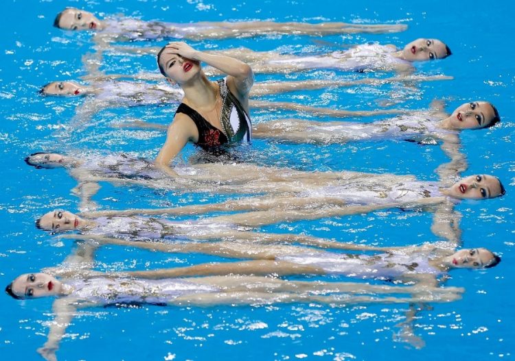 Sync & Giggle: Hilarious Snapshots of Synchronized Swimming