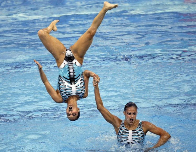 Sync & Giggle: Hilarious Snapshots of Synchronized Swimming