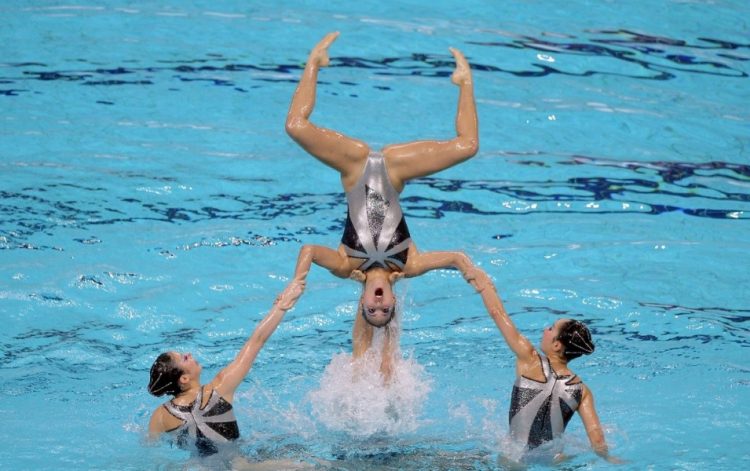 Sync & Giggle: Hilarious Snapshots of Synchronized Swimming