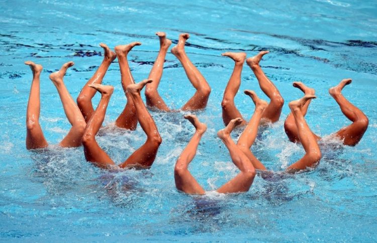 Sync & Giggle: Hilarious Snapshots of Synchronized Swimming