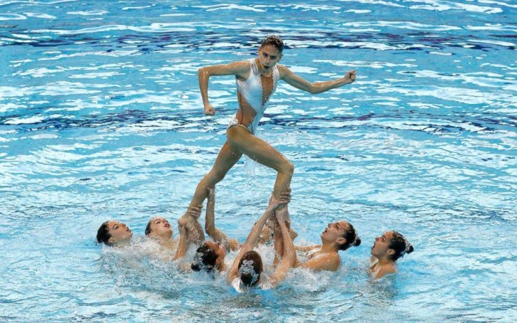 Sync & Giggle: Hilarious Snapshots of Synchronized Swimming