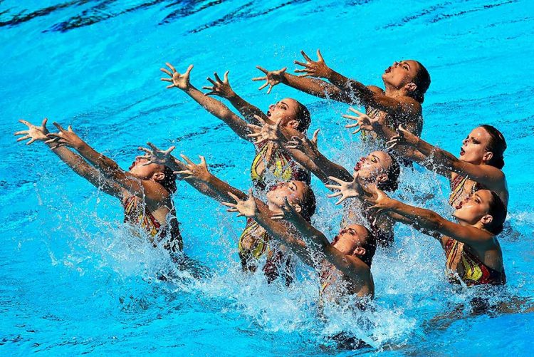 Sync & Giggle: Hilarious Snapshots of Synchronized Swimming